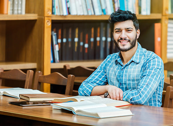 Sambhav IAS Student sitting in the Library